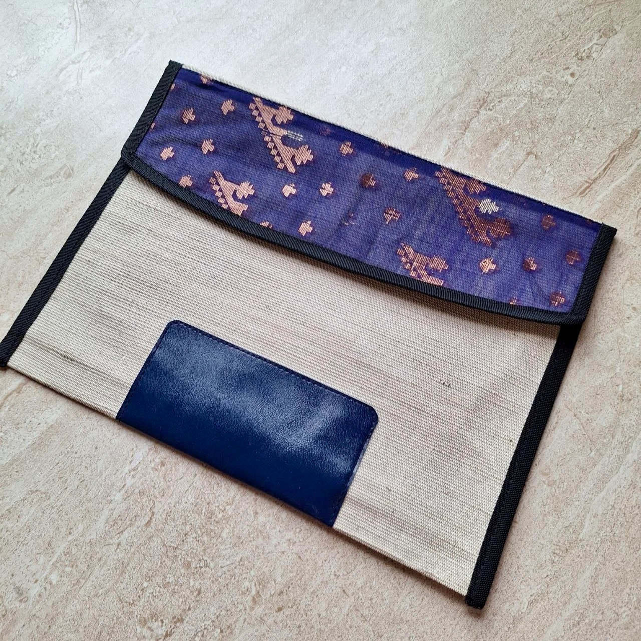 Natural file pouch with a purple patterned flap and navy panel