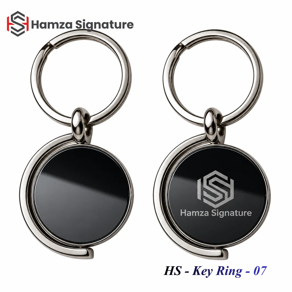 Two circular black metal keyrings showing blank and Hamza Signature branded faces