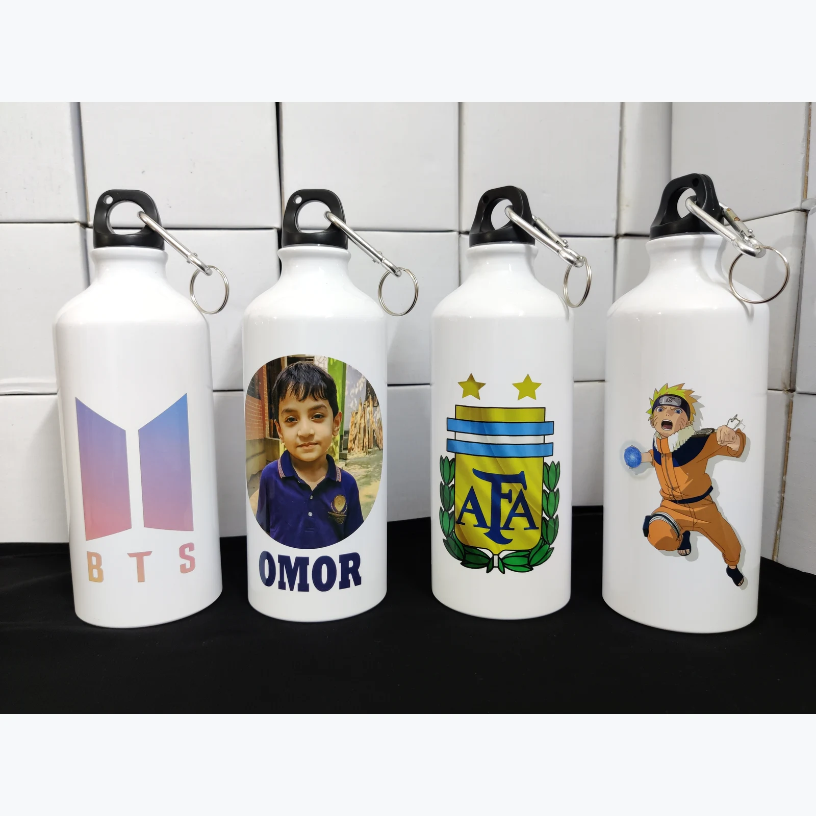 Four HS Water Bottle 13 bottles with custom printed designs