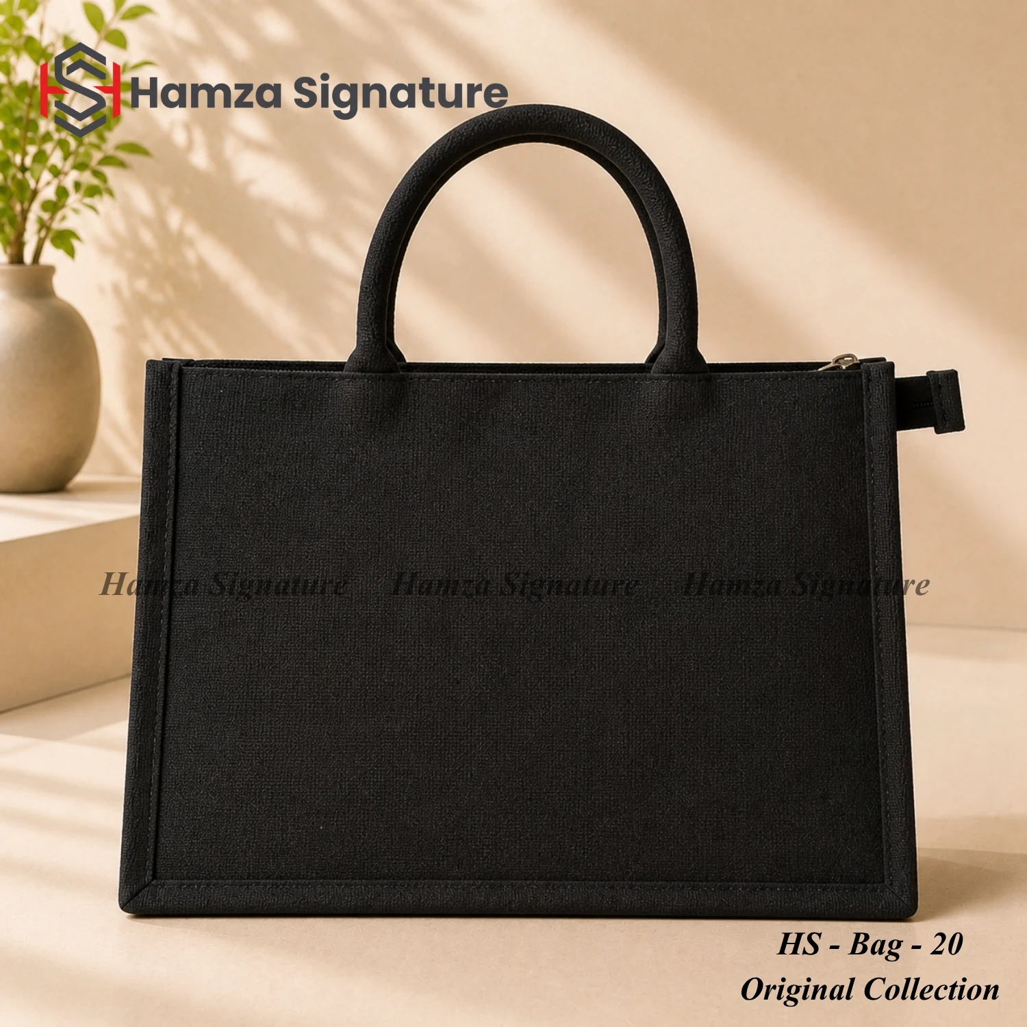 All-black structured jute-cotton tote with zip closure